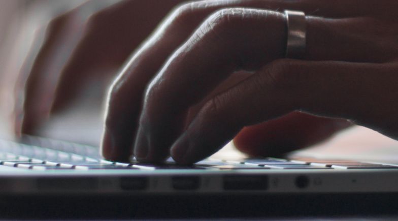 Woman typing on laptop