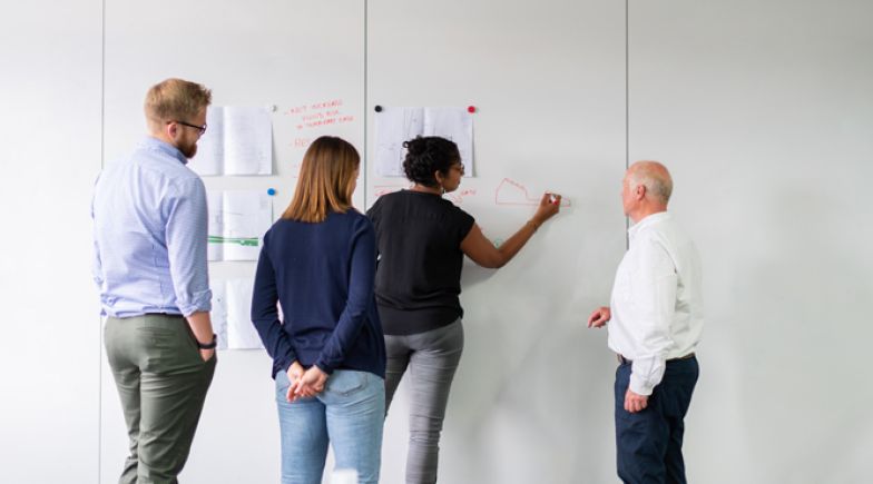 Engineers working on a project together